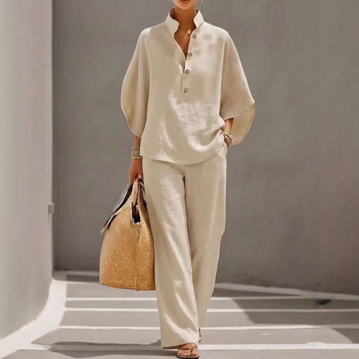 Cream linen blouse and wide-leg pants set with button front, carried with woven tote bag